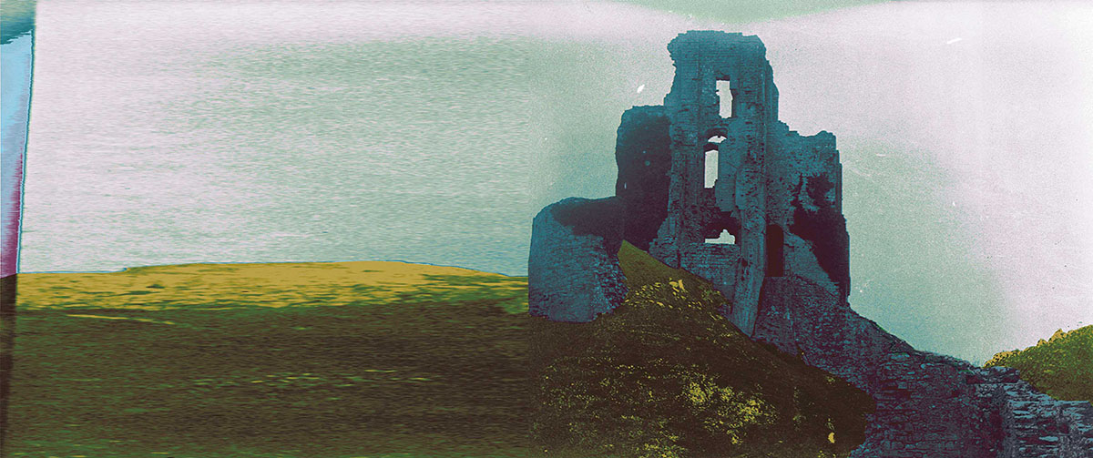 A photo of an unknown stone ruin atop a hill. The photo has been digitally altered, with blue and green applied on top of the original black-and-white photo.